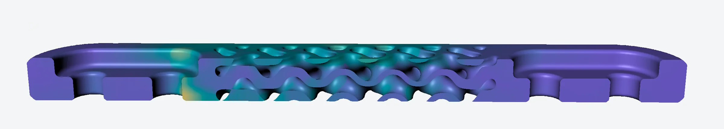 A long, thin part cut lengthwise, its TPMS interior coloured by von Mises stress from a Stereom solve